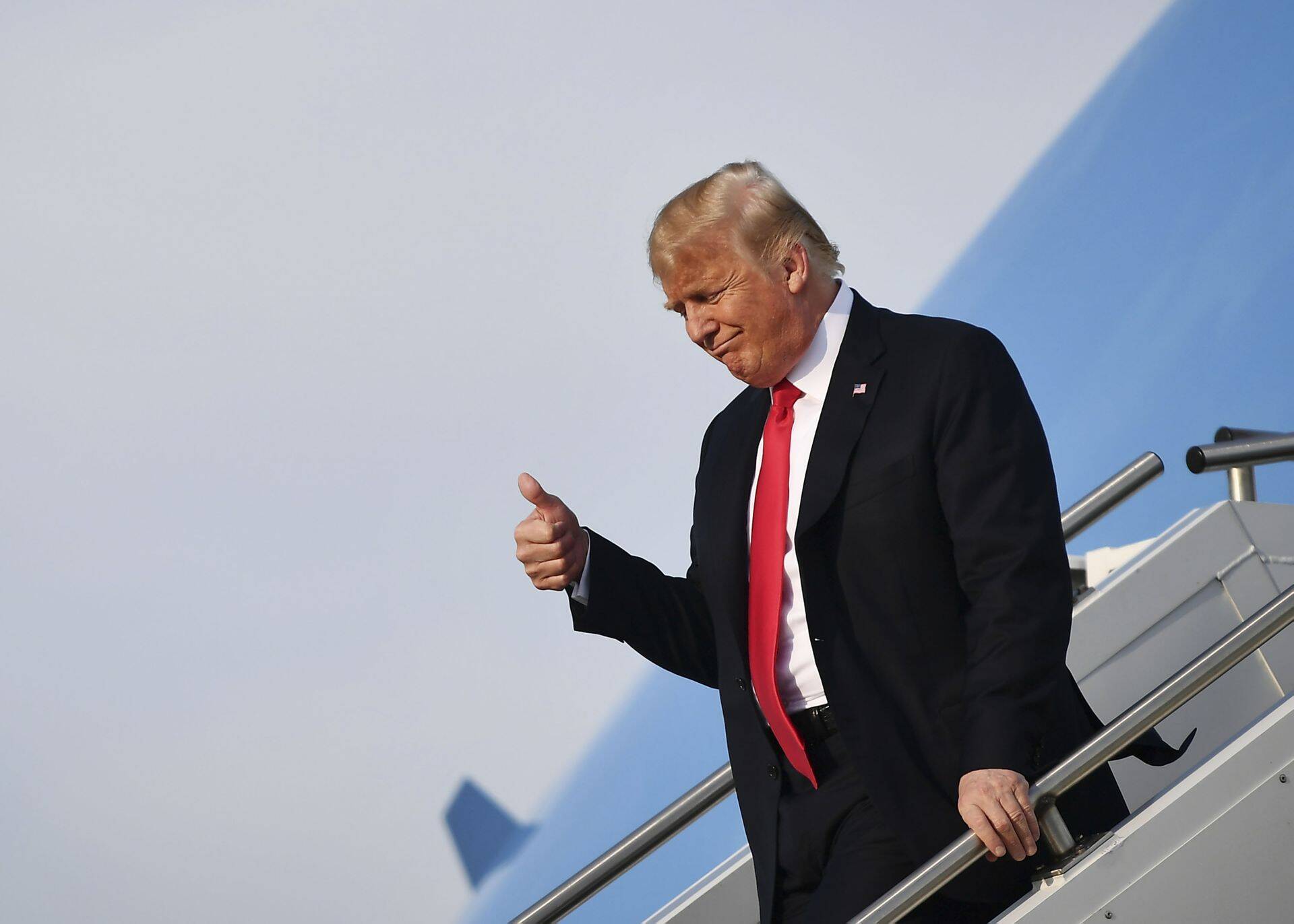 US President Donald Trump steps off Air Force One upon arrival at Evansville Regional Airport in Evansville, Indiana on August 30, 2018. - President Donald Trump on Thursday said the Russia collusion investigation headed by Special Counsel Robert Mueller is "illegal" as the probe continues to hone in on his inner circle. Trump told Bloomberg News in an interview that Mueller's appointment last year to investigate his 2016 election campaign for possible collusion with Russia was wrong. (Photo by MANDEL NGAN / AFP)