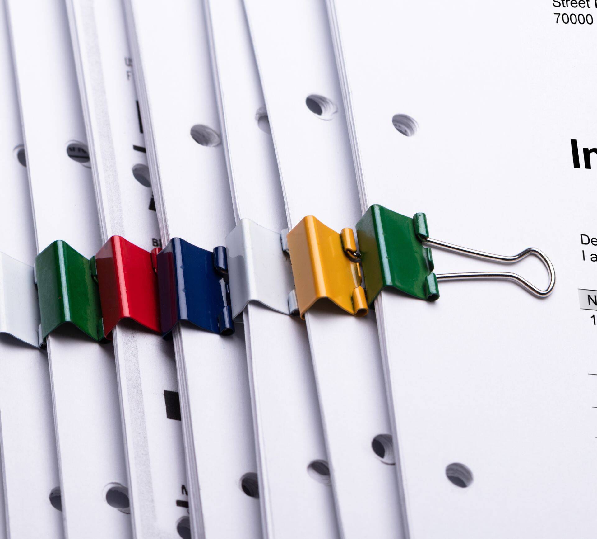 Close-up Of Documents With Paperclips