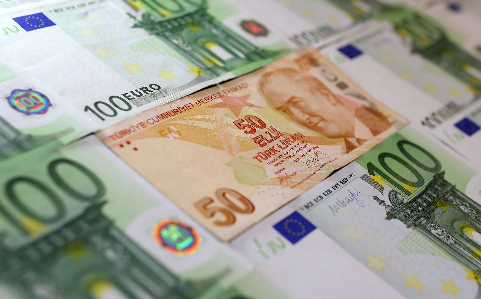 Turkish Lira and Euro banknotes are seen in this picture illustration taken June 25, 2018. REUTERS/Dado Ruvic/Illustration