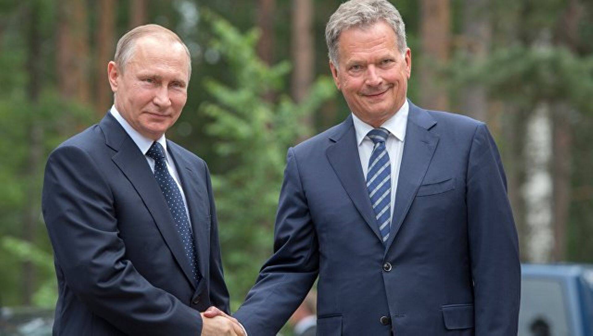 президент Финляндии и России Саули Ниинистё и Владимира Путина.