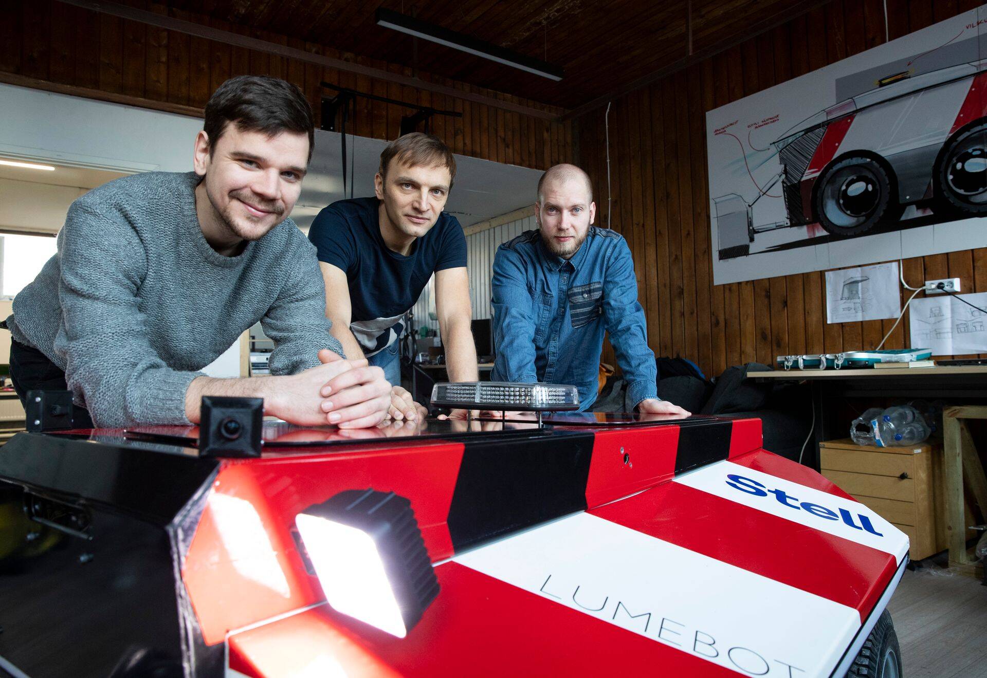 Lumebot engineer and co-founder Juhan Viik, Superangel investor Veljo Otsason and Lumebot co-founder Andres Kõiva demonstrating the third-generation street cleaning robot