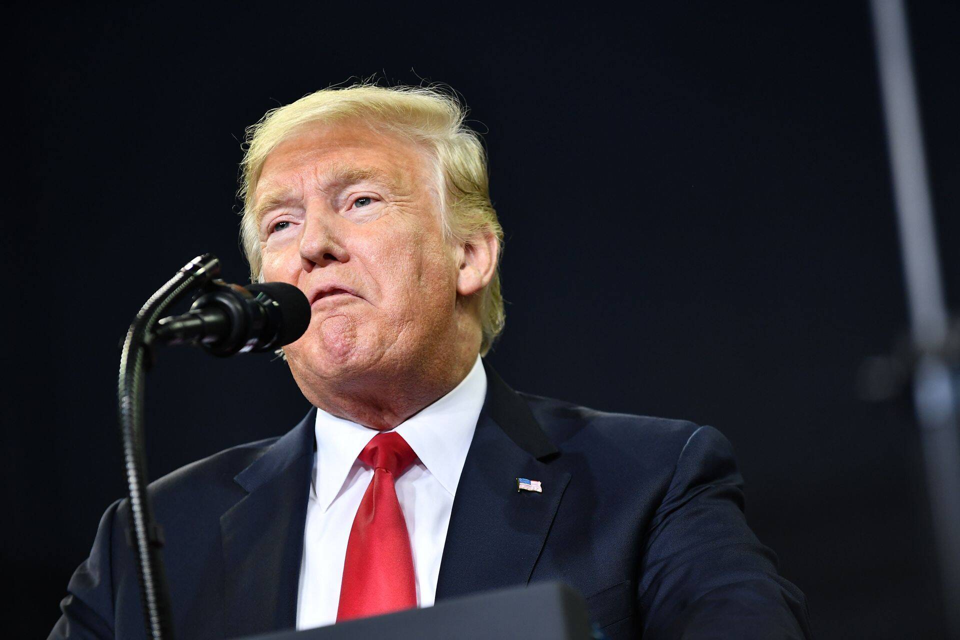 (FILES) In this file photo taken on August 30, 2018 US President Donald Trump speaks during a campaign rally at Ford Center in Evansville, Indiana. - President Donald Trump responded September 5, 2018 to a damning book about his presidency by journalist Bob Woodward by suggesting that Congress change US libel laws."Isn't it a shame that someone can write an article or book, totally make up stories and form a picture of a person that is literally the exact opposite of the fact, and get away with it without retribution or cost," Trump tweeted."Don't know why Washington politicians don't change libel laws?"The tweet was Trump's latest reaction to "Fear," Woodward's account of a "crazytown" White House in the grip of an angry, unhinged president whose aides scurry to keep him from blundering into war and other disasters. (Photo by MANDEL NGAN / AFP)