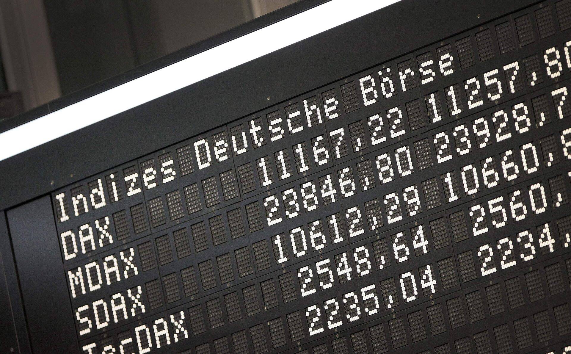 The display board of the German Stock Market Index DAX is pictured at the stock exchange in Frankfurt am Main, western Germany, on February 14, 2019. (Photo by Daniel ROLAND / AFP)